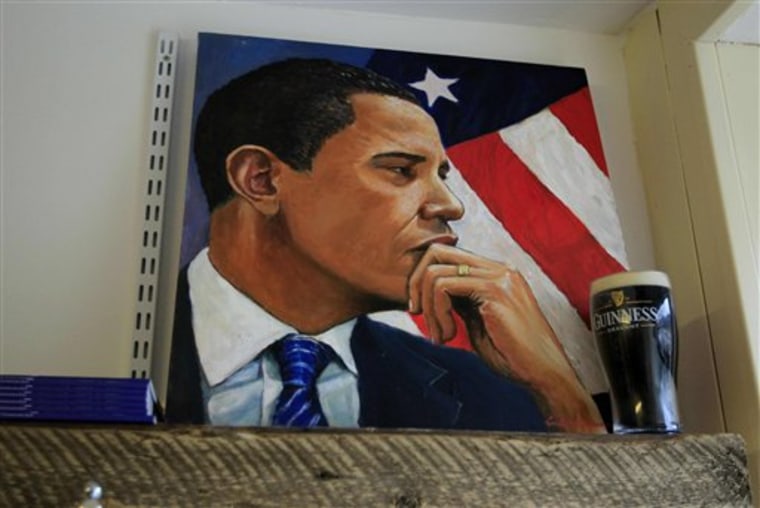 A painting of U.S. President Barack Obama stands next to a replica pint of Guinness in a shop in Moneygall, Ireland, Saturday, May 21. Obama is expected to visit the pub in the village of Moneygall, the ancestral homeland of his great-great-great grandfather, as part of his 24 hour visit to Ireland on Monday. 